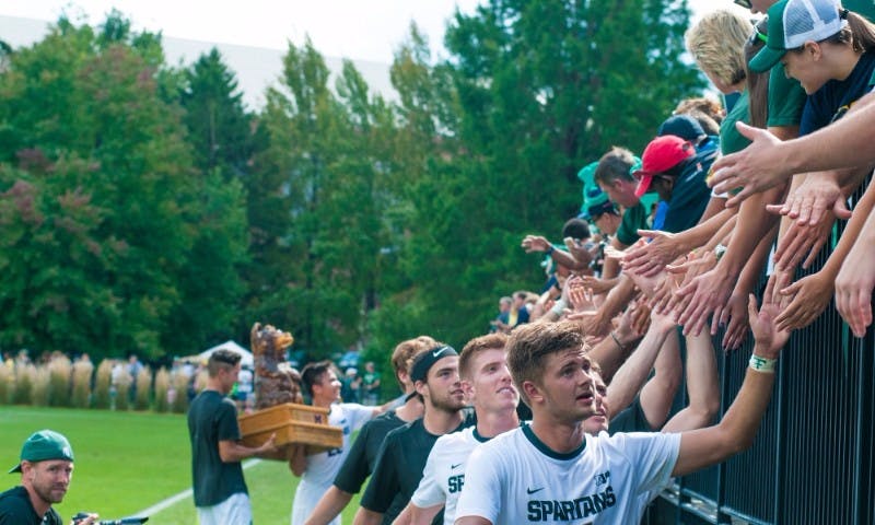 Sophomore forward Ryan Sierakowski (11) leads the team in a line treating the audience on Sept. 18, 2016 at DeMartin Stadium at Old College Field. The Spartans defeated the Michigan Wolverines, 1-0.