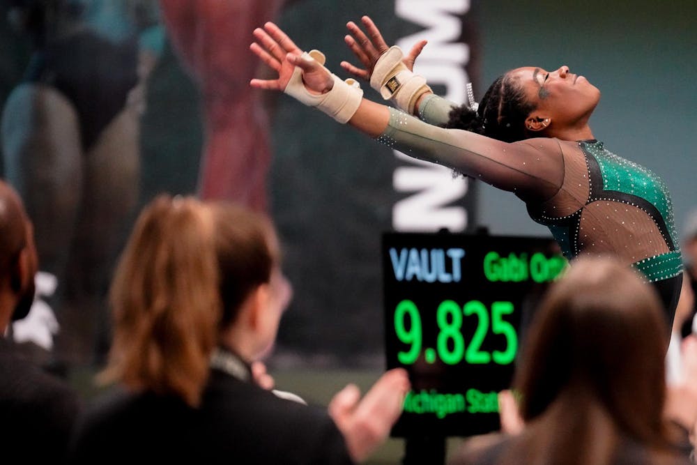 <p>All-Around junior Gabrielle Stephen completes her vault during a match against University of Iowa at Jenison Field House on Jan. 28, 2024. The Spartans defeated the Hawkeyes with a score of 197.400-195.700.</p>
