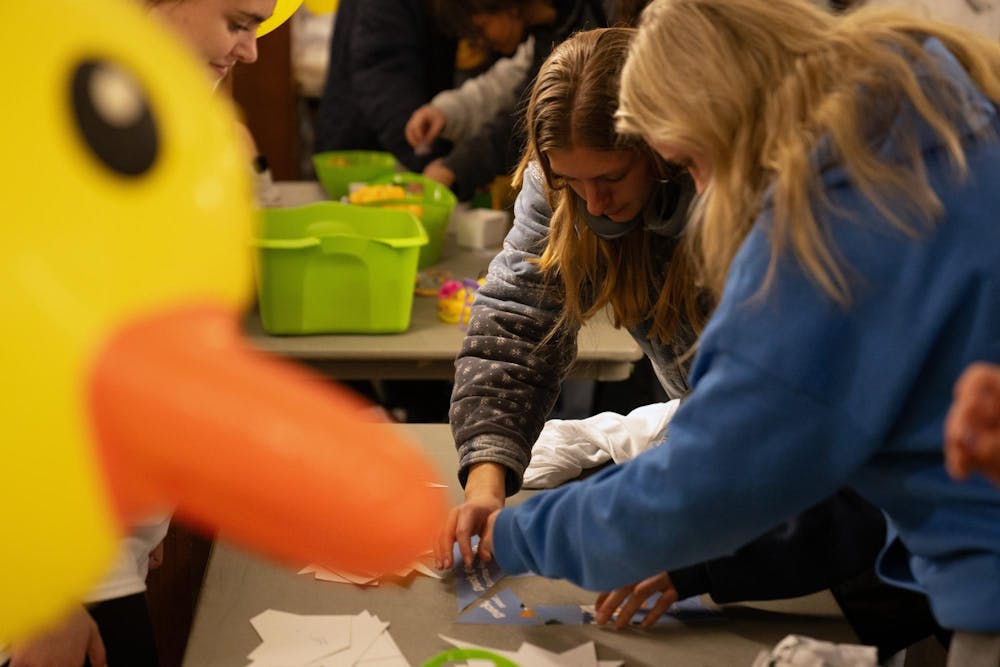 Michigan State students solve a puzzle to win rubber ducks at the student union during the Alcohol and Other Drugs Program's Farewell to the Flock event on Dec. 2, 2024.