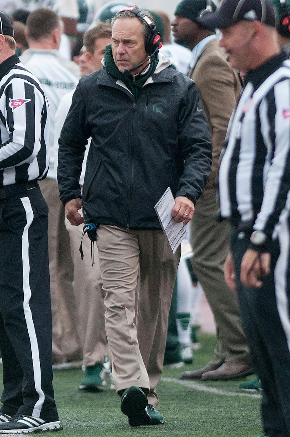 <p>Head coach Mark Dantonio reacts to a touchdown by Indiana during the game against Indiana on Oct. 18, 2014, at Memorial Stadium in Bloomington, Ind. The Spartans defeated the Hoosiers, 56-17. Jessalyn Tamez/The State News</p>