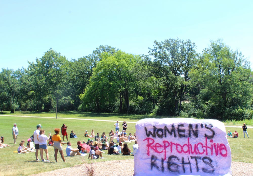 <p>Students gather at The Rock on Farm Lane at an emotional rally to protest the recent overturning of Roe V. Wade on July 10, 2022. </p>