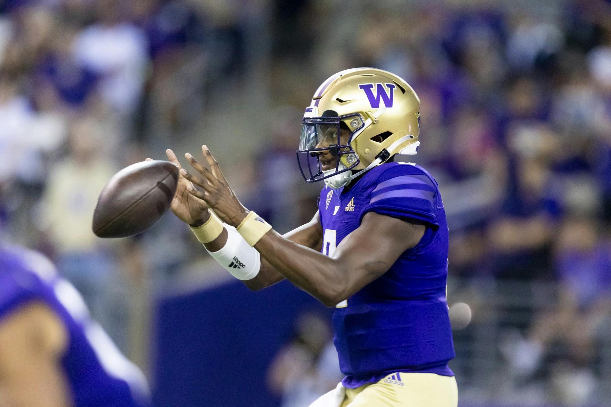 <p>Michael Penix Jr. catches the snap during Washington&#x27;s game versus Kent State at Husky Stadium on Sept. 3, 2022 (Photo Courtesy of Maddy Grassy/ The Daily UW).</p>