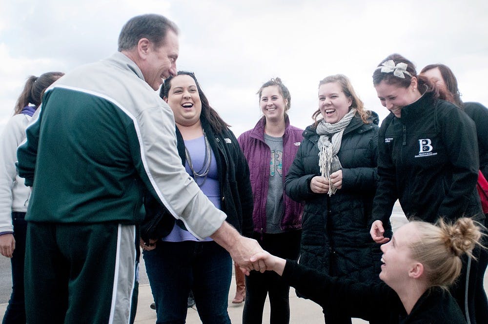 	<p>Head coach Tom Izzo shakes hands with <span class="caps">MSU</span> students before the basketball team leaves for Indiana to play in the <span class="caps">NCAA</span> Men&#8217;s Basketball Tournament on Wednesday, March 27, 2013, at Breslin Center. The Spartans play against Duke on Friday night. Katie Stiefel/The State News</p>