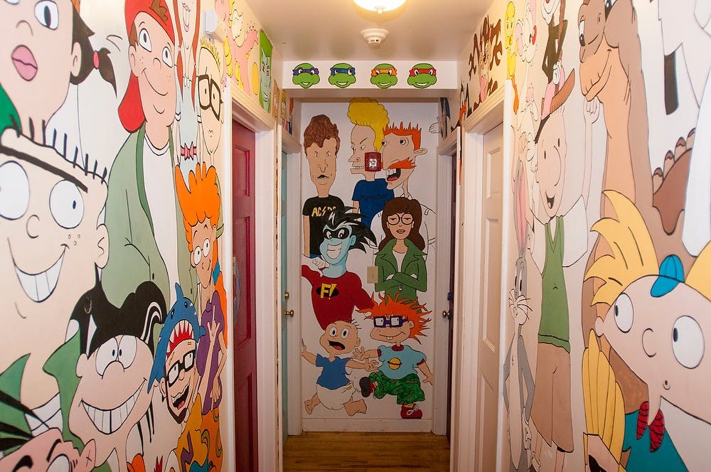 <p>Cartoon characters are painted on a hallway Oct. 15, 2014, at the Phoenix House on Oakhill Avenue in East Lansing. Raymond Williams/The State News</p>