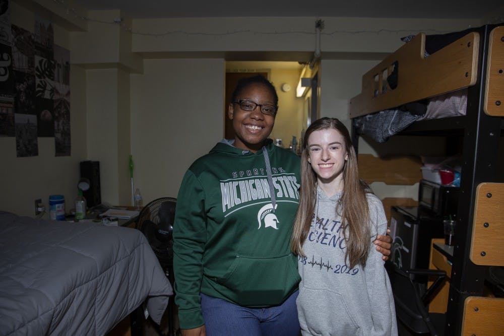 Journalism freshman SaMya Overall and human biology freshman Kailen Cooper pose for a portrait  together in their dorm room at Hubbard Hall on Oct. 2, 2019. The two have been friends for three years and are current roommates. 