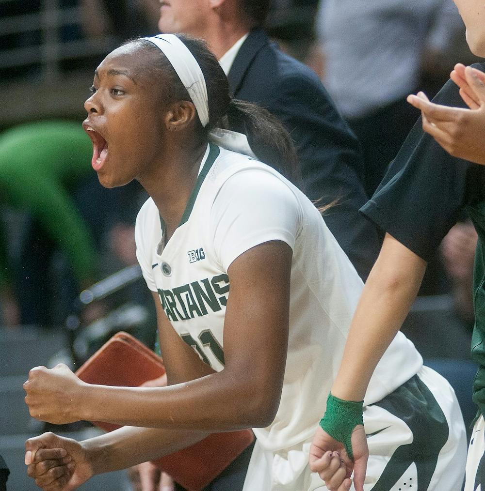 <p>Freshman guard/forward Jasmine Lumpkin cheers on her teammates from the sidelines Dec. 4, 2014, during the game against Georgia Tech at Breslin Center. The Spartans defeated the Yellow Jackets in overtime, 79-73. Raymond Williams/The State News</p>