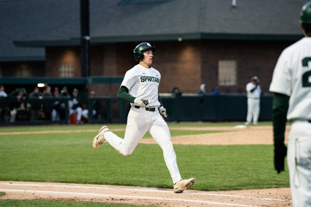<p>MSU player sprints to first base, April 19, 2022. </p>