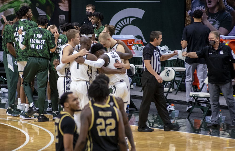 <p>Michigan State starters huddle up before their game against Western Michigan. The Spartans came back in the second half to end the game against the Broncos 79-61 on Dec. 6, 2020.</p>