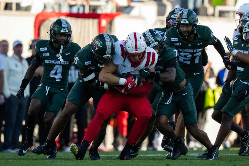 <p>A Nebraska ball carrier is brought down by multiple Michigan State defenders during the Spartans’ game against Nebraska at Spartan Stadium in East Lansing, Mich., on Saturday, Sept. 26, 2026.</p>
