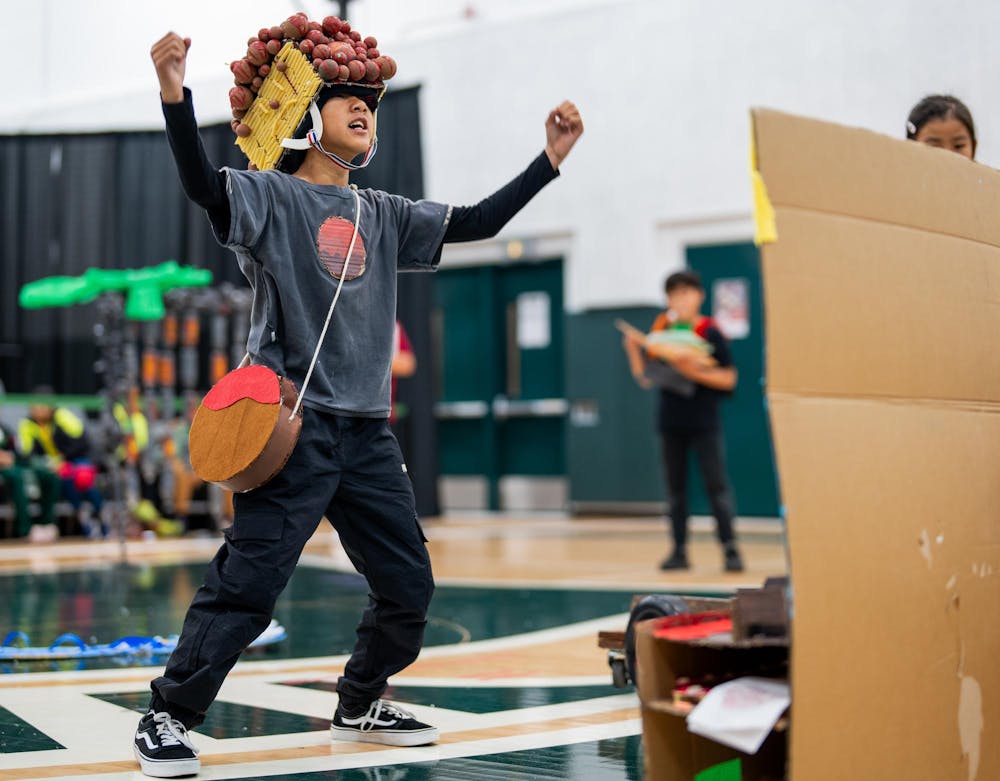 An Odyssey of the Minds competitor competes in the The OM-Mazing Race​ in the Jack Breslin Center in East Lansing, Michigan on May 22, 2025. The The OM-Mazing Race​ challenges competitors to design, build, and operate a vehicle alongside a theme and set of obstacles while performing a skit, combining STEM skills with creativity. 