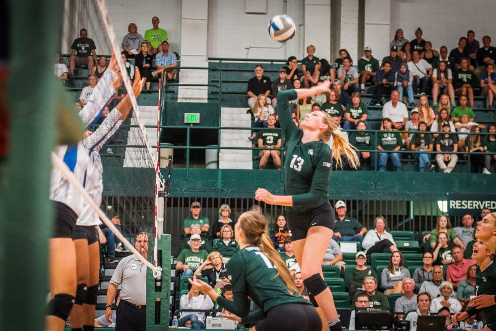 <p>Redshirt senior outside hitter Brooke Kranda (13) goes up for a kill during the game against Texas A&amp;M on Sep. 2, 2017, at Jenison Field House. The Spartans defeated the Islanders, 3-0.</p>