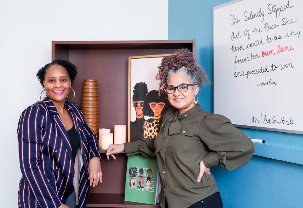 <p>Professor Gianina K.L. Strother and Dr. Yvonne Morris pose for a photo in Professor Strother's office in the Department of African American and African Studies in North Kedzie on Feb. 2, 2023.</p>