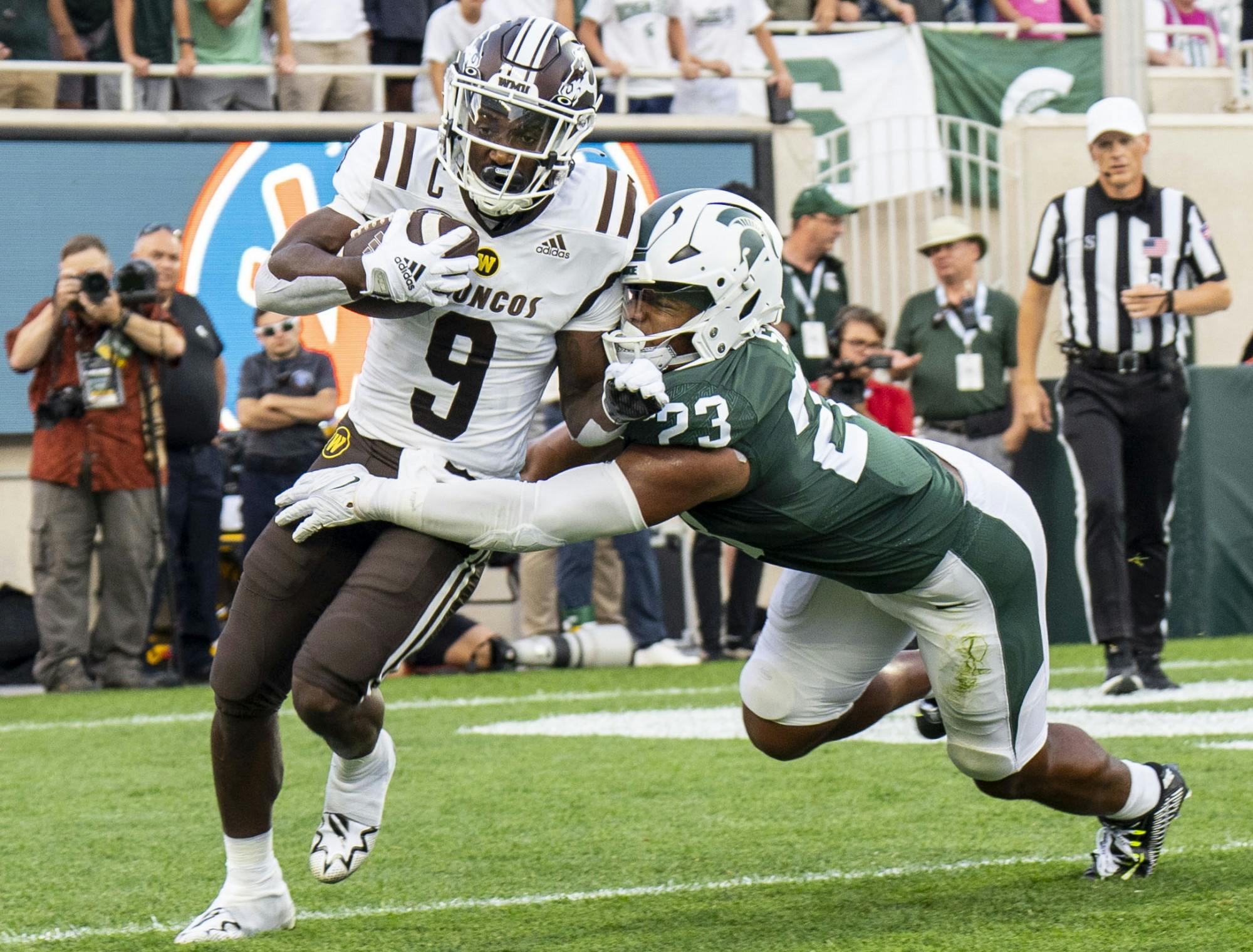 <p>Junior linebacker Darius Snow, 23, tackles Western’s Sean Tyler, 9, during Michigan State’s home opener against Western Michigan at Spartan Stadium on Sept. 2, 2022. </p>