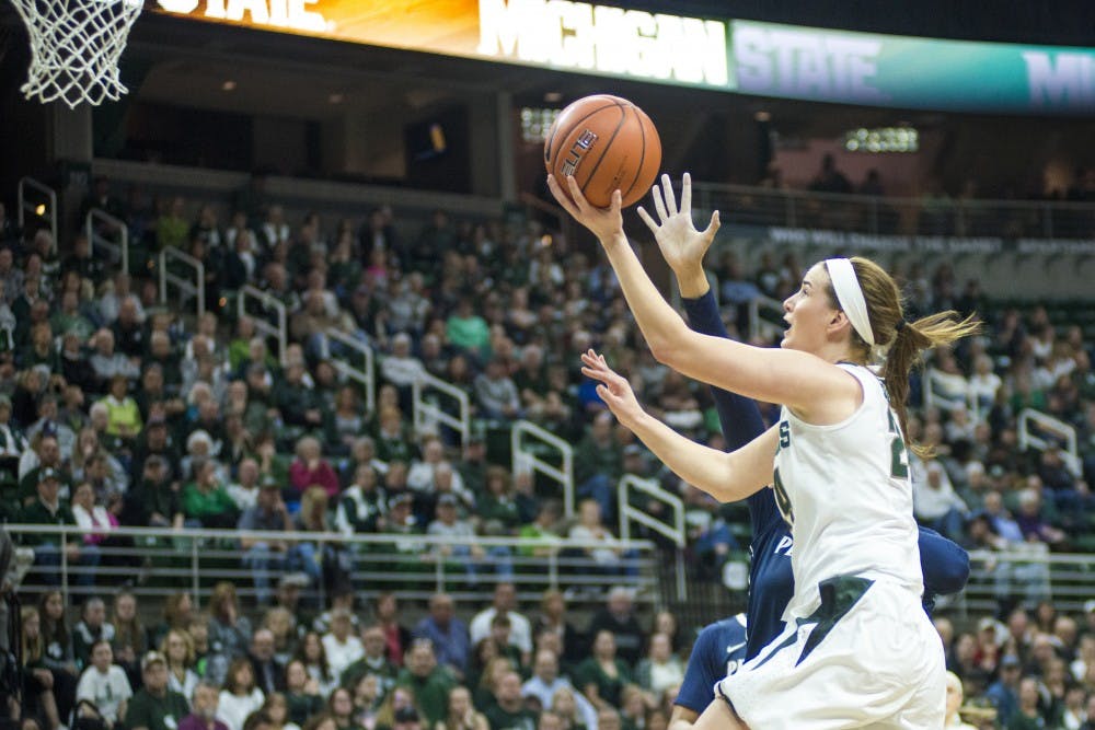 Junior guard and forward Lexi Gussert (24) goes for a lay up during the women's basketball game against Pennsylvania State University on Feb. 22, 2017 at Breslin Center. The Spartans trailed the Nittany Lions at the half, 40-26.