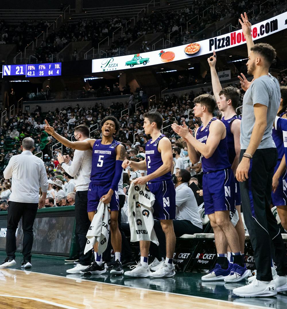 <p>Northwestern celebrates on the sideline after their team scores a three-pointer during Michigan State&#x27;s loss on Jan. 15, 2022.</p>