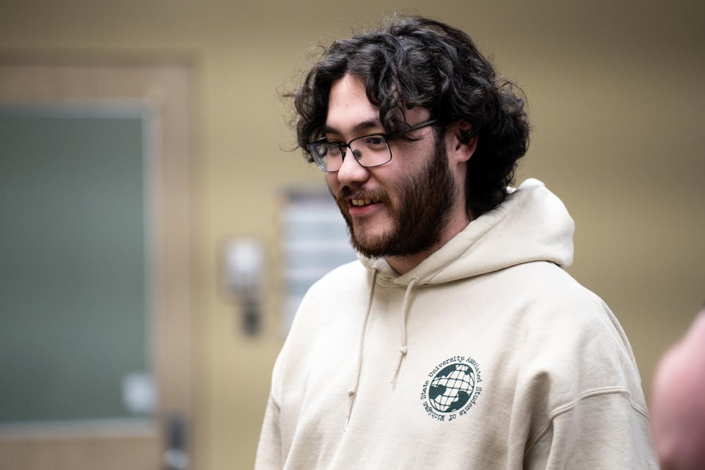 Attendees listen to the ASMSU presidential candidates at the MSU Student Services buildings on April 15, 2025