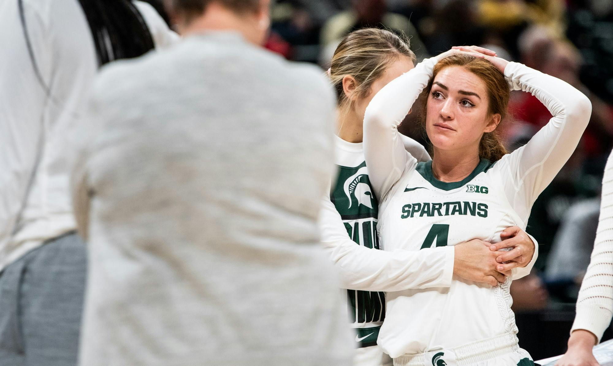 Redshirt junior Laurel Jacqmain puts her arms around a teary-eyed Taryn McCutcheon (4) during the game against Purdue at Bankers’ Life Fieldhouse in Indianapolis March 5, 2020. The Spartans fell to the Boilermakers, 72-63.