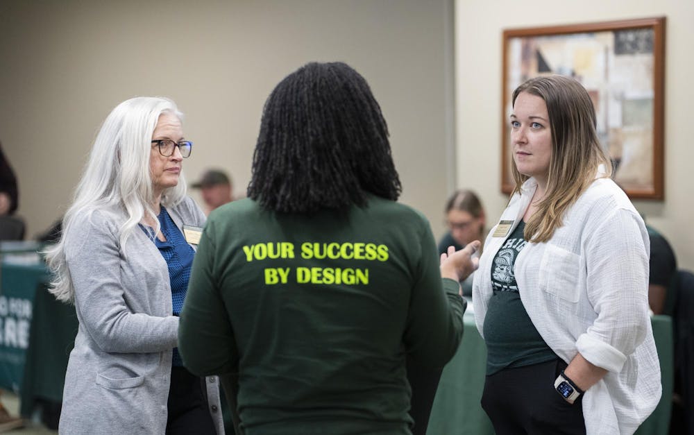 Heather Shea (affiliate faculty for Student Affairs PRXIS and professional development), Jieron Robinson (Program Director, TRIO Student Support Services), and Sarah Ward (Assistant Director for First-Generation Student Success) engaged in discussions during the First-Gen student event at the Union on Nov. 4, 2024.