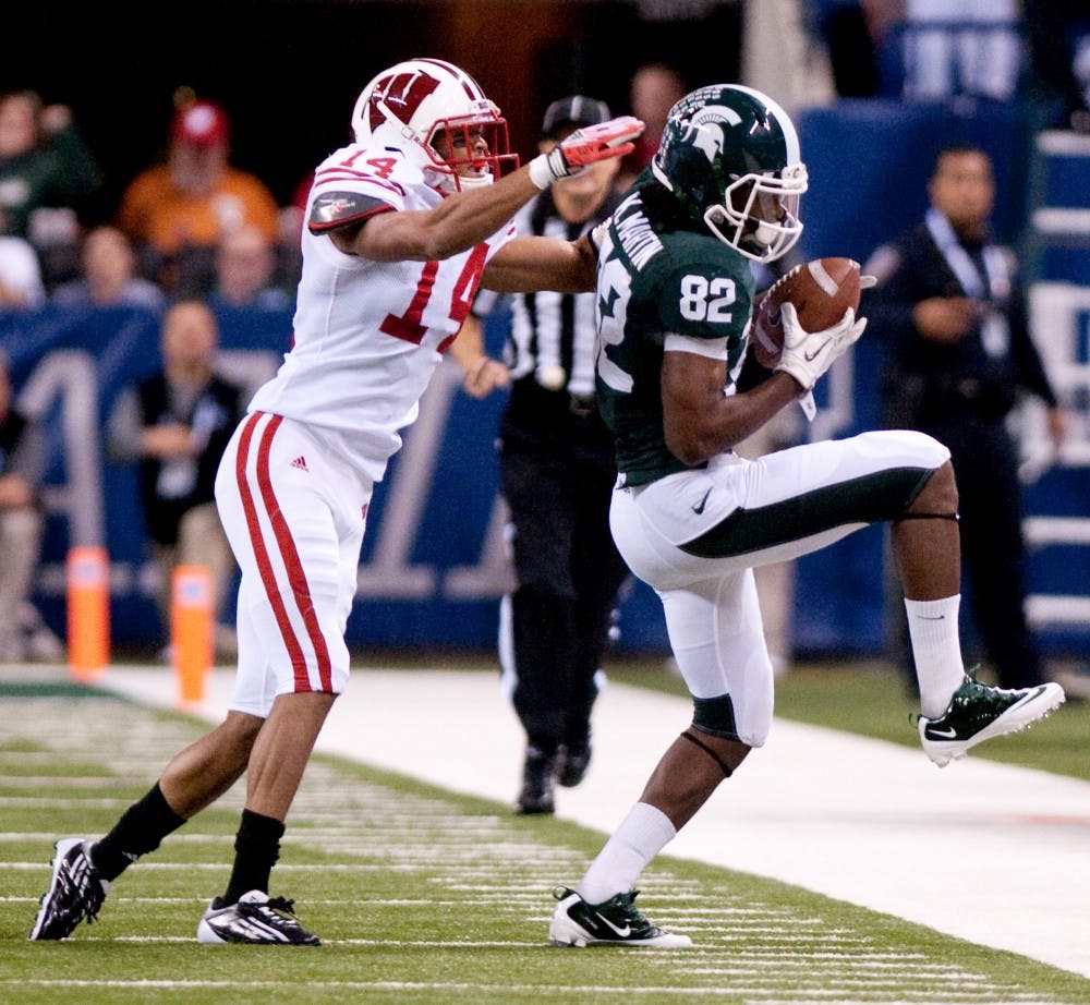 Senior wide receiver Keshawn Martin hauls in a pass. The Spartans lost to the Wisconsin Badgers, 42-39, in the Big Ten Championship game on Saturday night at Lucas Oil Stadium in Indianapolis, Ind. Josh Radtke/The State News