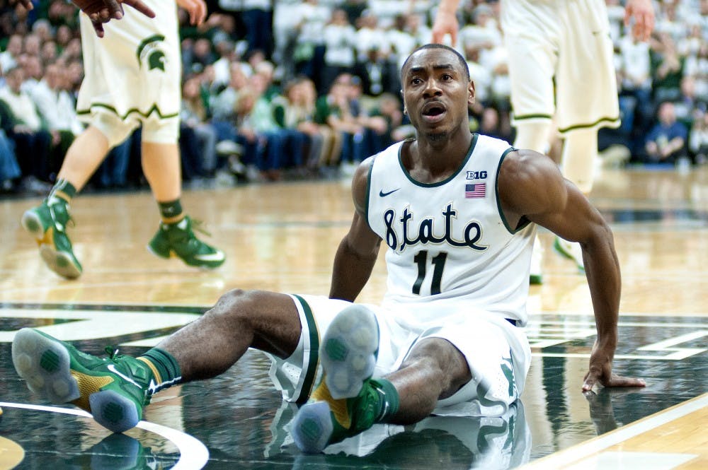 Sophomore guard Lourawls Nairn Jr. falls to the ground after getting fouled during the game against Iowa on Jan. 14, 2016 at Breslin Center. The Spartans were defeated by the Hawks, 76-59 .