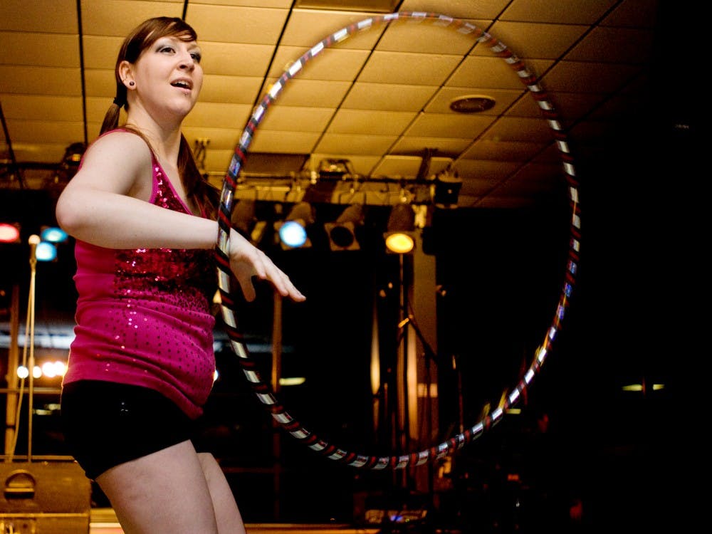 Master of social work student Nicole Minty shows off her hula hooping skills Saturday night for the annual Showtyme @ MSU talent show. Showtyme was hosted by UAB and the MLK Celebration Planning Committee and featured various talent from across campus. Derek Berggren/The State News