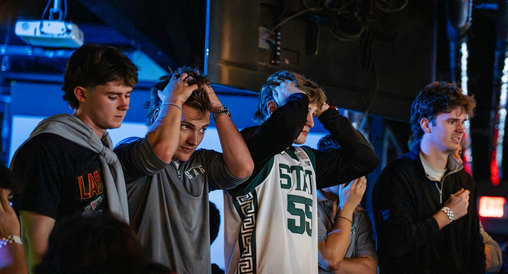 <p>Fans react to an intense moment during the NCAA men’s basketball tournament regional semifinal game between Michigan State and UConn at Harper's Restaurant &amp; Brew Pub in East Lansing, Michigan on Friday, March 27, 2026.</p>