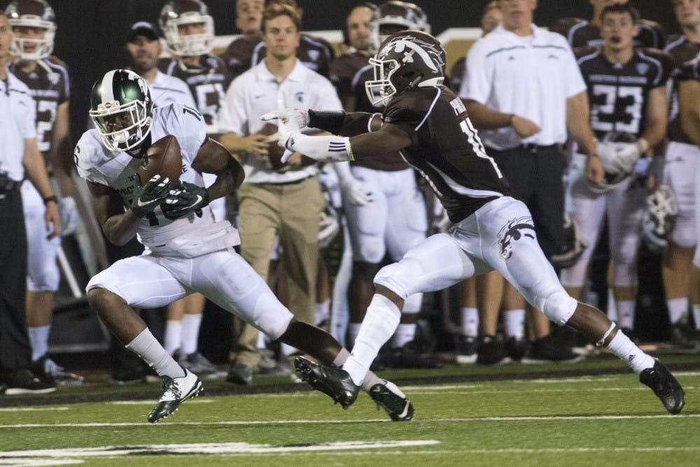 <p>Western Michigan cornerback Darius Phillips chases after senior wide receiver Aaron Burbridge on Sept. 4, 2015, during a game against Western Michigan at Waldo Stadium in Kalamazoo, Mich. The Spartans beat the Broncos, 37-24. Julia Nagy/The State News</p>