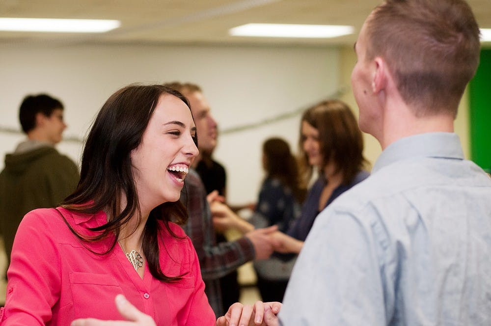 	<p>Clinical laboratory science senior Ashley Varner dances with second year law student Andrew Gardner on Nov 20, 2013, at the Plant and Soil Sciences building. The event was held to teach newcomers how to dance, as well as to raise money for those impacted by Typhoon Haiyan in the Philippines. Brian Palmer/The State News</p>