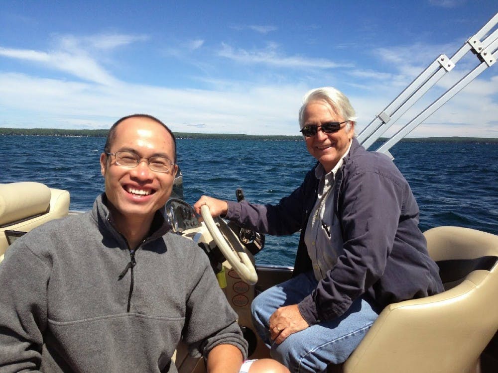 <p>Shengpan Lin, left, is pictured on a boat with MSU Professor Jan Stevenson. <strong>Photo courtesy of Ashton Shortridge.</strong></p>