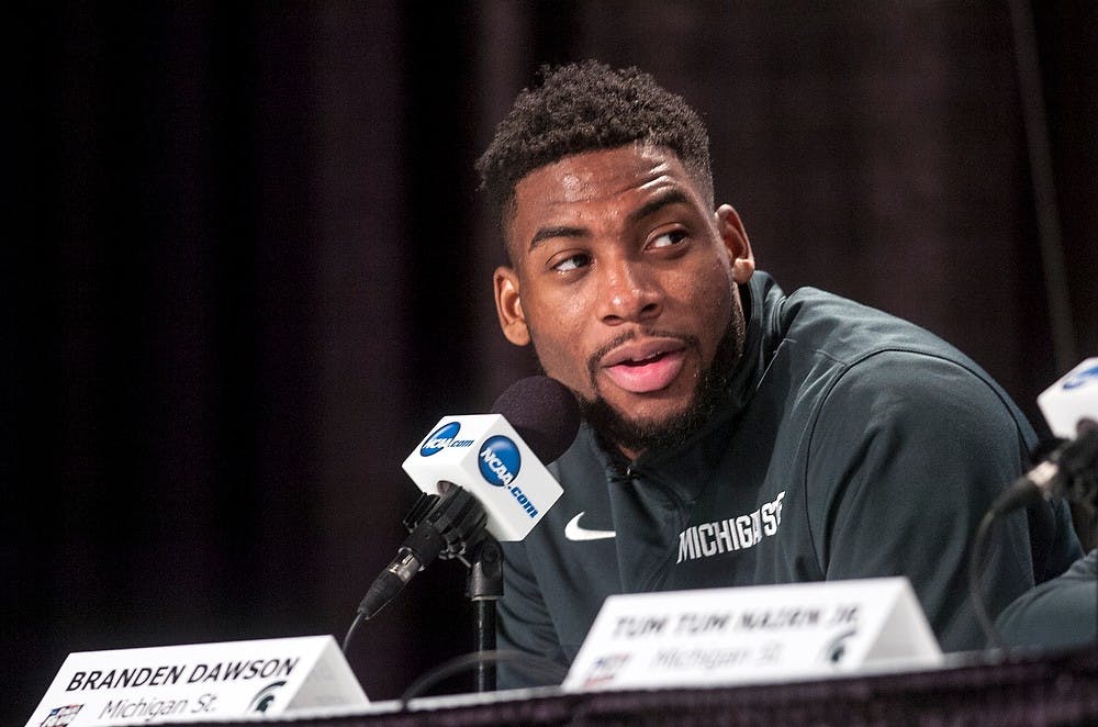 <p>Then-senior forward Branden Dawson responds to a question April 3, 2015, during a press conference at the NCAA Tournament in the Final Four round at Lucas Oil Stadium in Indianapolis. Dawson was arrested March 13, 2016&nbsp;for alleged domestic violence charges, according to a TMZ report.</p>