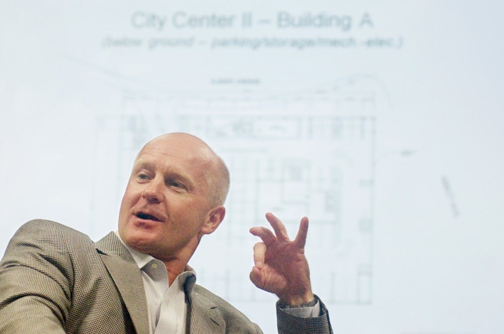 Scott Chappelle, president of Strathmore Development Co., discusses with students about the City Center II project at Hubbard Hall Monday afternoon. Students will provide their inputs as part of their hospitality business class project, covering areas such as finance, design, construction and marketing. Justin Wan/The State News 