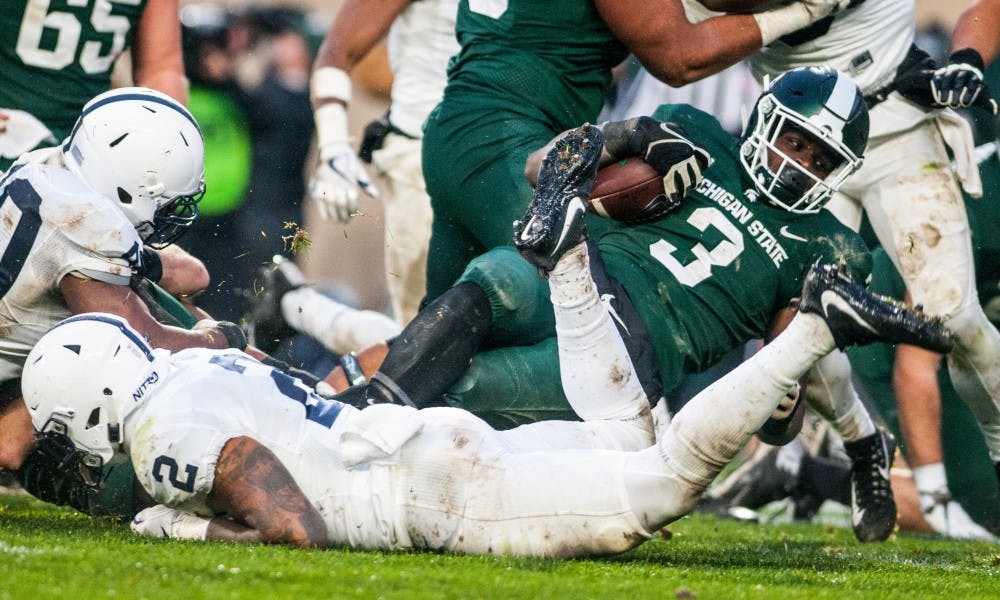 Junior running back LJ Scott (3) carries the football during the game against Penn State, on Nov. 4, 2017, at Spartan Stadium. The Spartans defeated the Nittany Lions, 27-24.