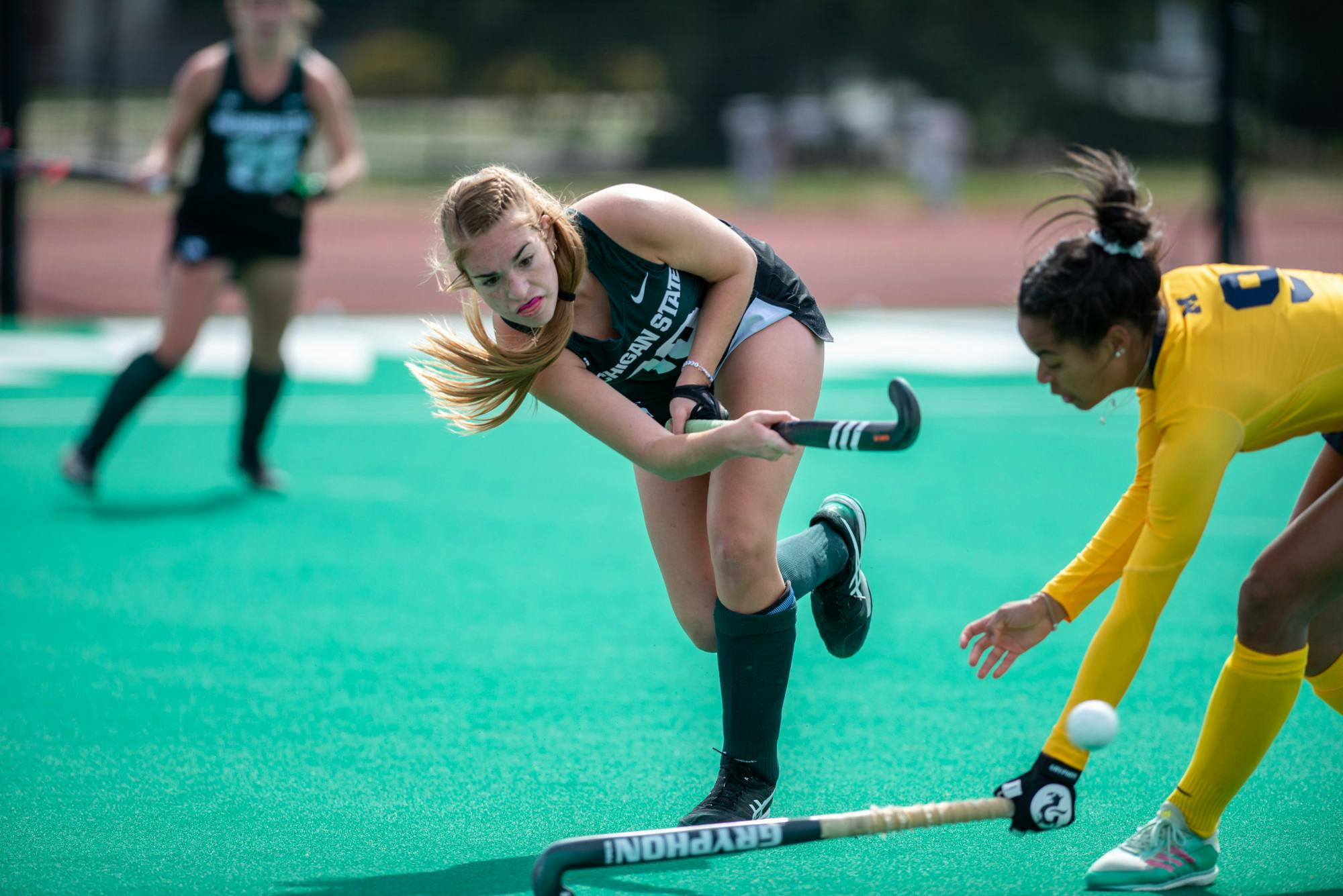 <p>MSU midfielder Emma O&#x27;Neill passes the ball during a game against Michigan on April 2, 2021.</p>