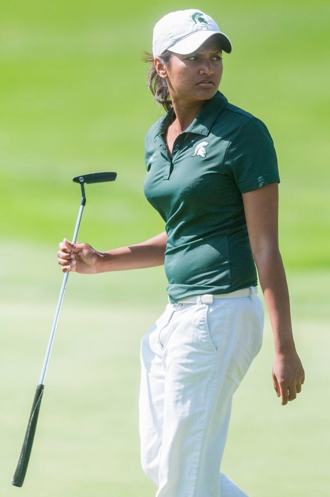 Junior Yushira Budhram walks to the putting green at the Mary Fossum Invitational on Sunday afternoon at Forest Akers West Golf Course. The MSU golf team took second place at the 2012 Mary Fossum Invitational. Natalie Kolb/The State News