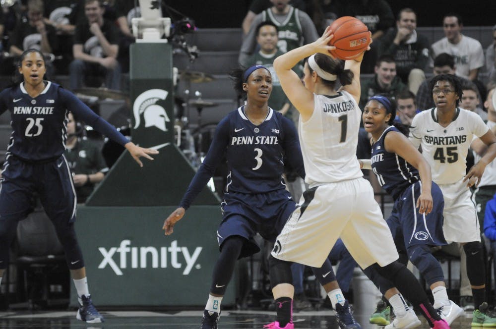 Junior guard Tori Jankoska throws the ball as she is defended by Penn State guard Brianna Banks during the game against Penn State on Feb. 11, 2016 at the Breslin Center. Spartans were defeated by the Nittany Lions  65-61.