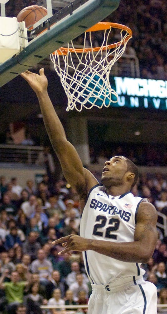 Freshman guard Brandon Dawson lays up the ball Saturday night at Breslin Center. The Michigan State Spartans beat the Nebraska Cornhuskers 62-34. Derek Berggren/The State News