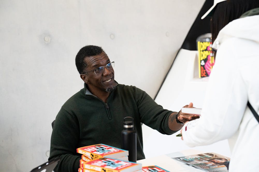 Author James Mott, signing his book "Hell of a Book", at Broad Museum on Apr. 7, 2023.