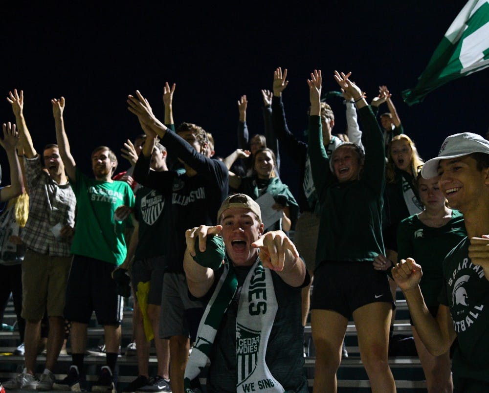 A Red Cedar Rowdies member celebrates after catching a shirt from the fan shirt toss during the game at DeMartin field on September 24, 2019. The Spartans lost to the Fighting Irish 0-1. 