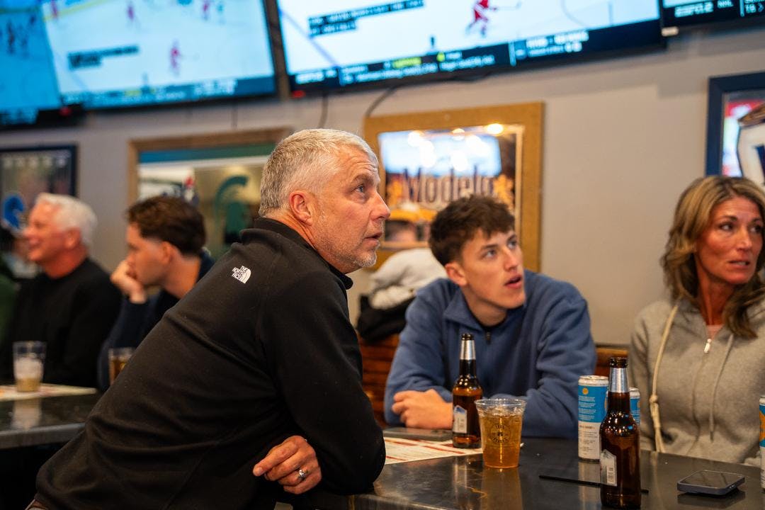 <p>Spectators watch MSU Hockey take on the Wisconsin Badgers at Lou and Harry's Bar and Grill on March 28, 2026. The Spartans fell to the Badgers in overtime, 4-3.</p>