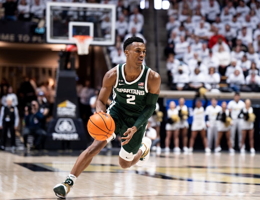 <p>Senior guard Tyson Walker (2) dribbles the ball during a game against Purdue at Mackey Arena on Jan. 29, 2023. The Spartans lost to the Boilermakers 77-61. </p>