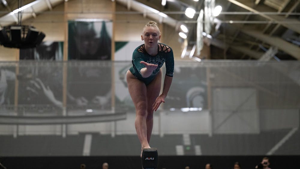 Cady Duplissis, sophomore, performs her choreography on the balance beam during the MSU tri-meet at Jenison Field House on Sunday, Feb. 15, 2026.