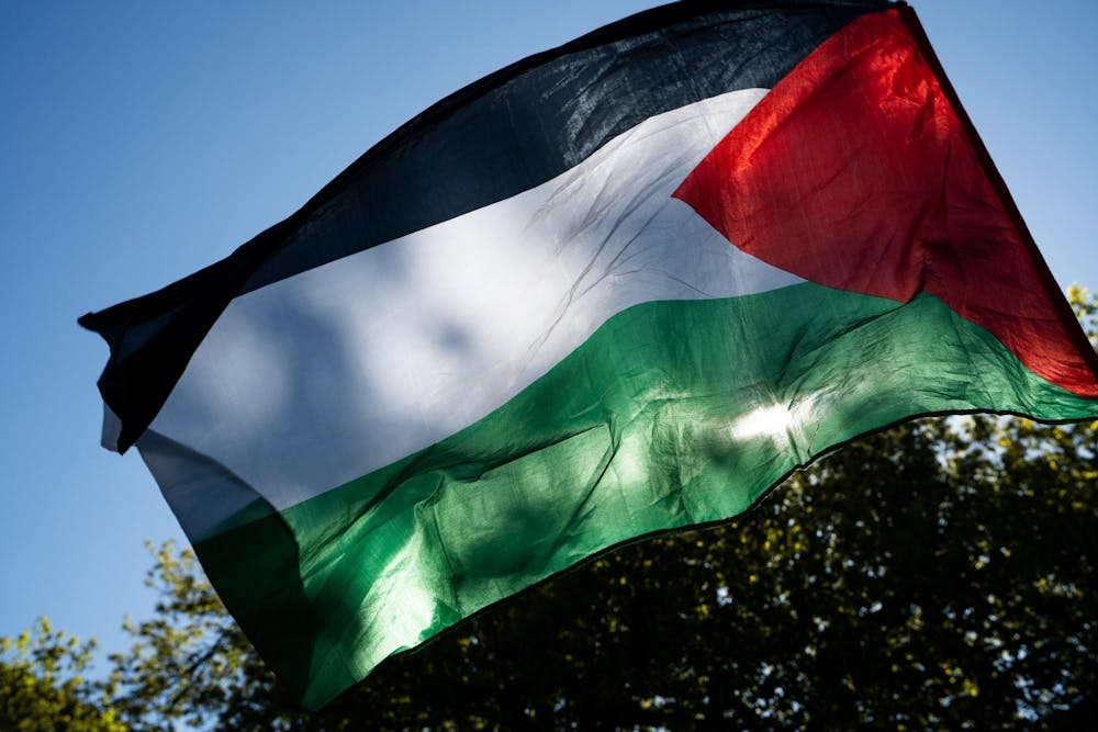 The Palestinian flag waves over the Gaza solidarity encampment in People’s Park on MSU’s campus on April 25, 2024.