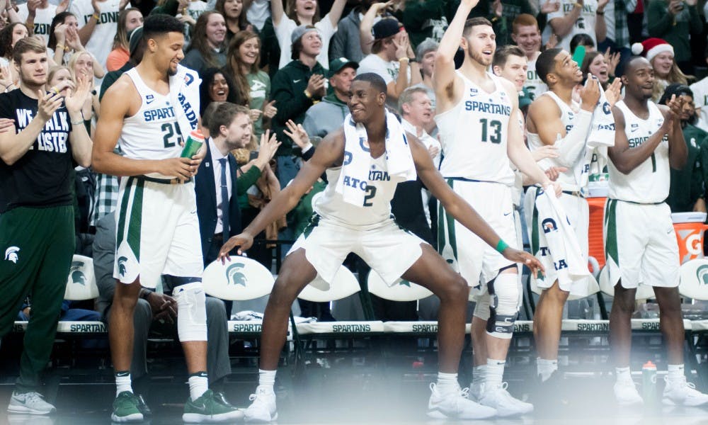The Spartans celebrate a three-pointer during the game against Nebraska on Dec. 3, 2017, at Breslin Center. The Spartans defeated the Cornhuskers 86-57.