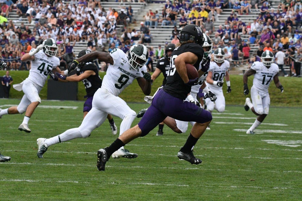 <p>Junior defensive back Dominique Long looks to make a tackle during the game against Northwestern on Sept. 21, 2019 at Ryan Field. Spartans led the Wildcats 14-3 at the half.</p>