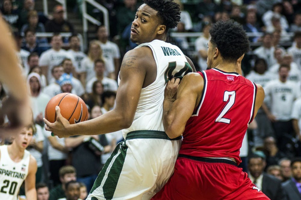 Freshman forward Nick Ward (44) is covered by Youngstown State forward Devin Haygood (2) during the second half of the men's basketball game against Youngstown State on Dec. 6, 2016 at Breslin Center. The Spartans defeated the Penguins, 77-57.