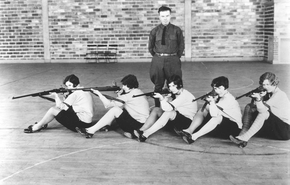 <p>Members of the Women's Rifle Team practice shooting from a sitting position sometime between 1920 and 1929. Photo courtesy of the MSU Archives and Historical Collections.&nbsp;</p>