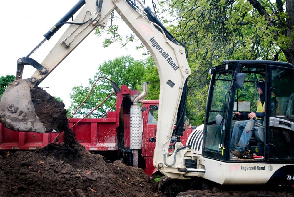 	<p>Operator Kyle Salyer manipulated a crane at The Eli and Edythe Broad Art Museum construction site on Wednesday. Salyer contributed by digging the trench at which the communication duct main will be buried. Mo Hnatiuk/The State News</p>