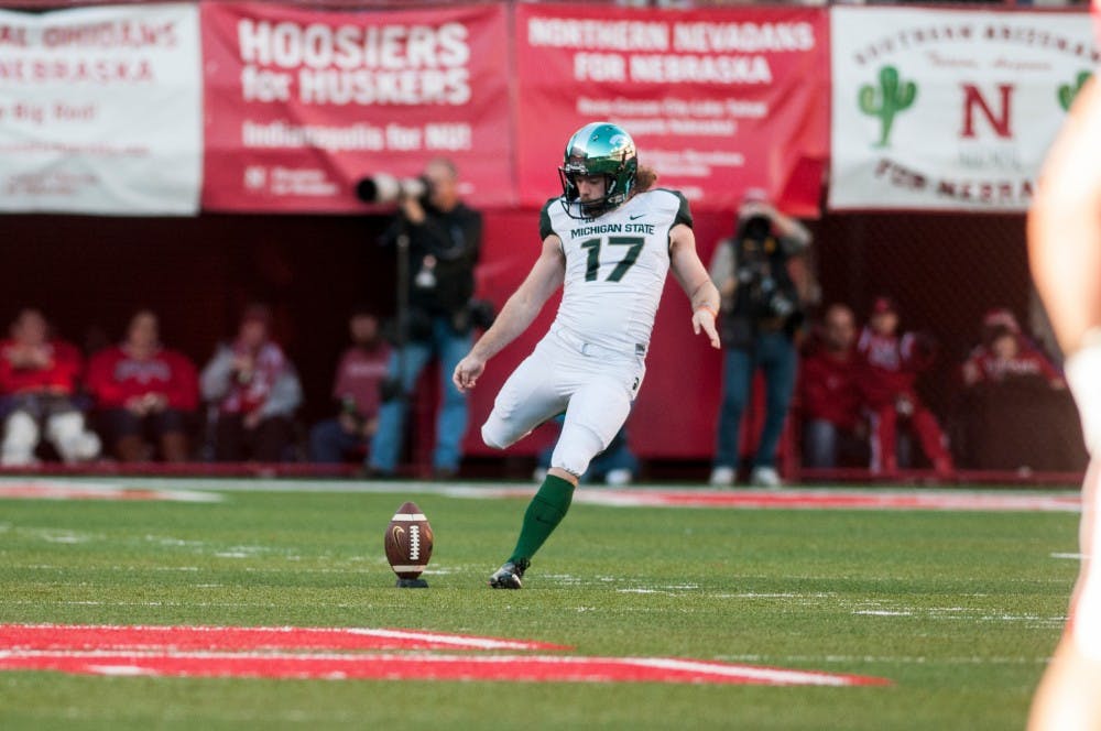 	<p>Senior kicker Kevin Muma kicks off during the game against Nebraska on Nov. 16, 2013, at Memorial Stadium in Lincoln, Neb. The Spartans defeated the Cornhuskers, 41-28. Khoa Nguyen/The State News</p>