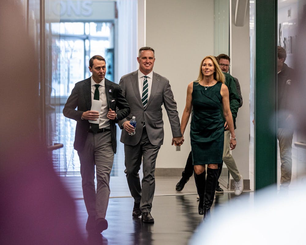 MSU's new football HC Pat Fitzgerald walks to his MSU welcome speech in the Tom Izzo football building in East Lansing, MI on Dec. 2, 2025.