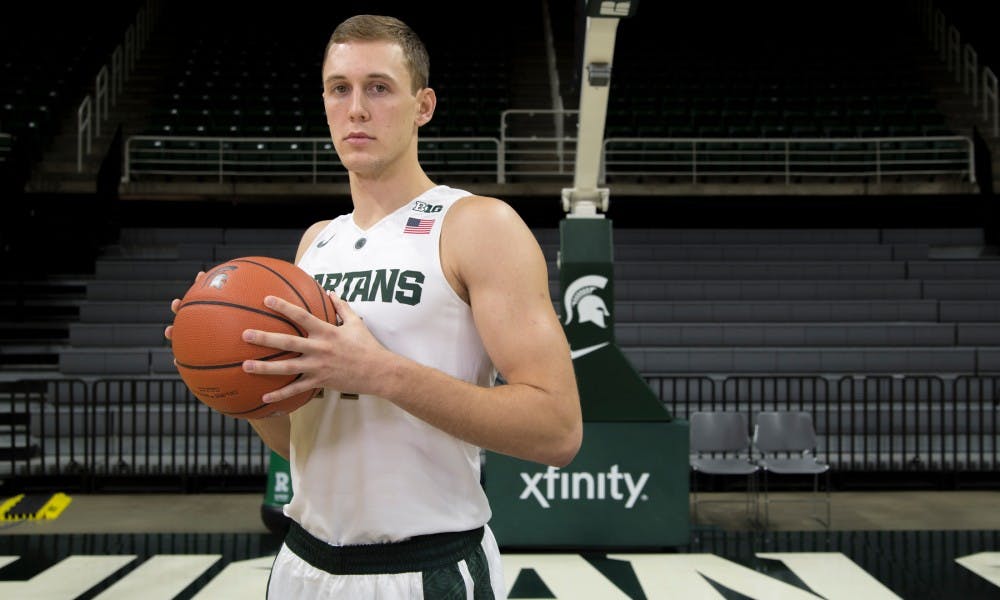 <p>Senior forward Colby Wollenman poses for a portrait during men's basketball media day on Oct. 27, 2015 at Breslin Center.</p>